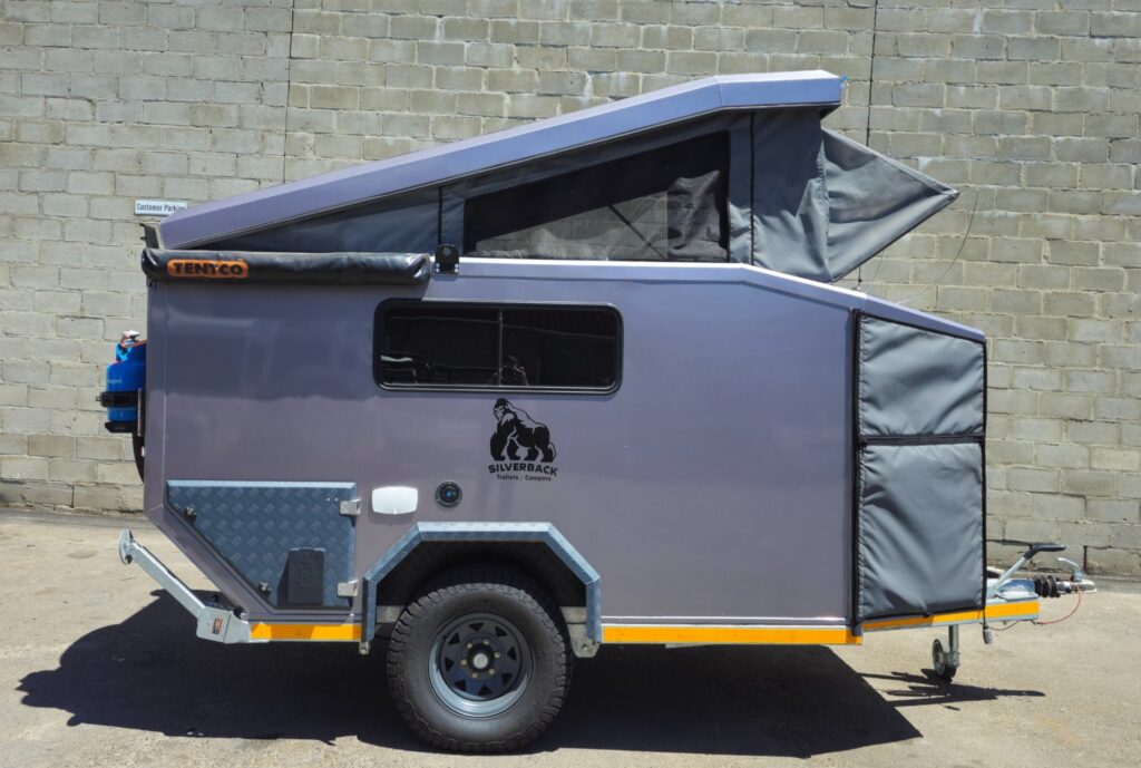 Silverback Lunar off-road camper trailer with the pop-up roof raised, seen from the side