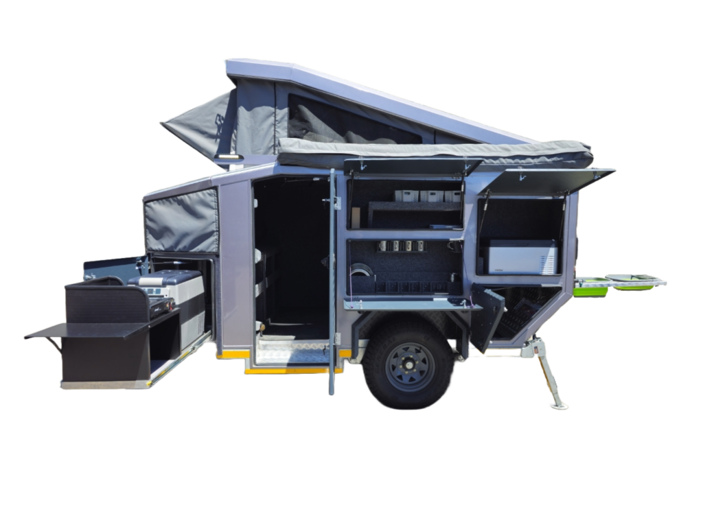 Lunar camper opened on the right, showing the kitchen slide with fridge, storage lockers and interior door
